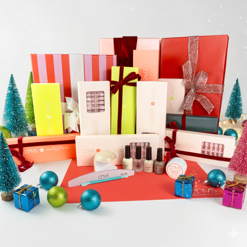 The Holiday Fit Collection with pink and nude nails in all shapes and sizes plus tools for application by CNVS Nails