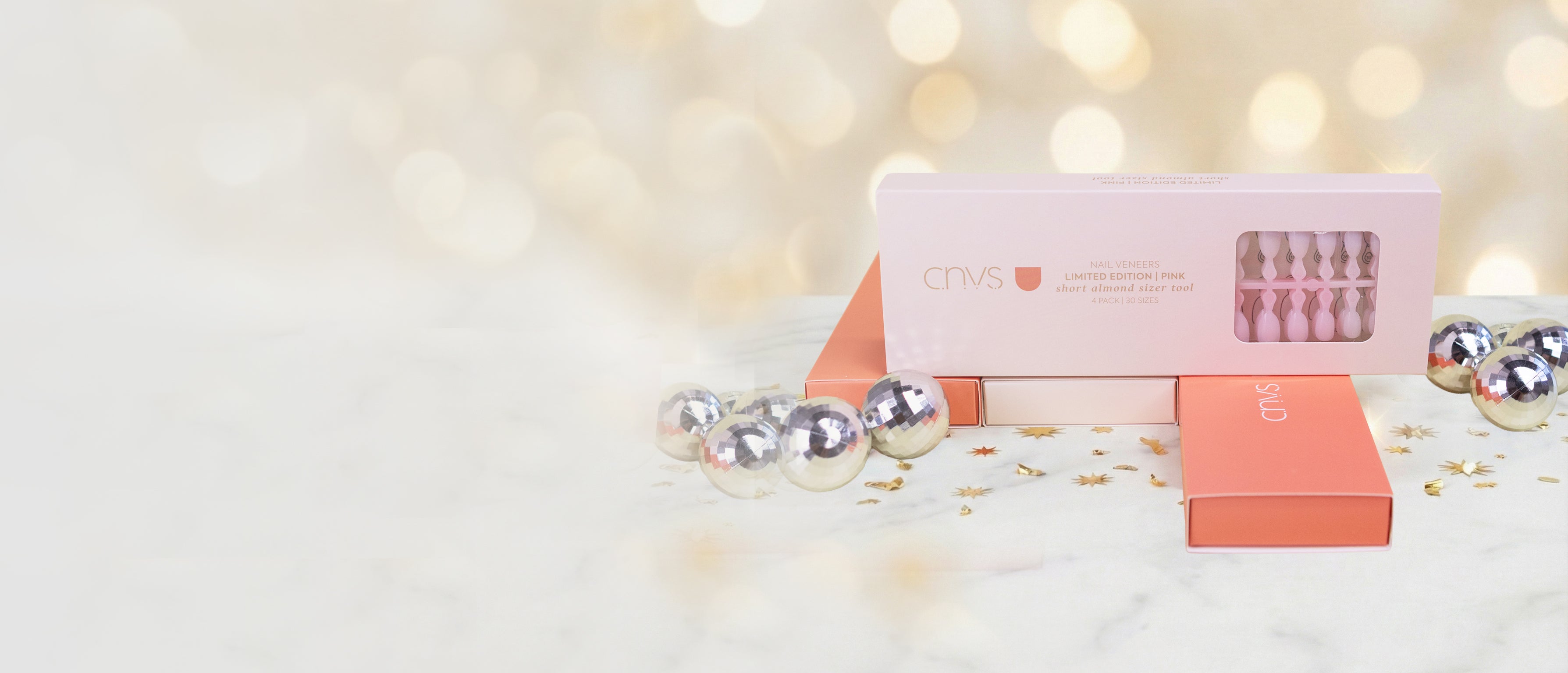 pink cnvs nails in packaging with other cnvs nails sizer tools