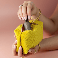 Limited Edition Pink Medium Square Manicure by CNVS Nails. Modeled by the hands of a woman