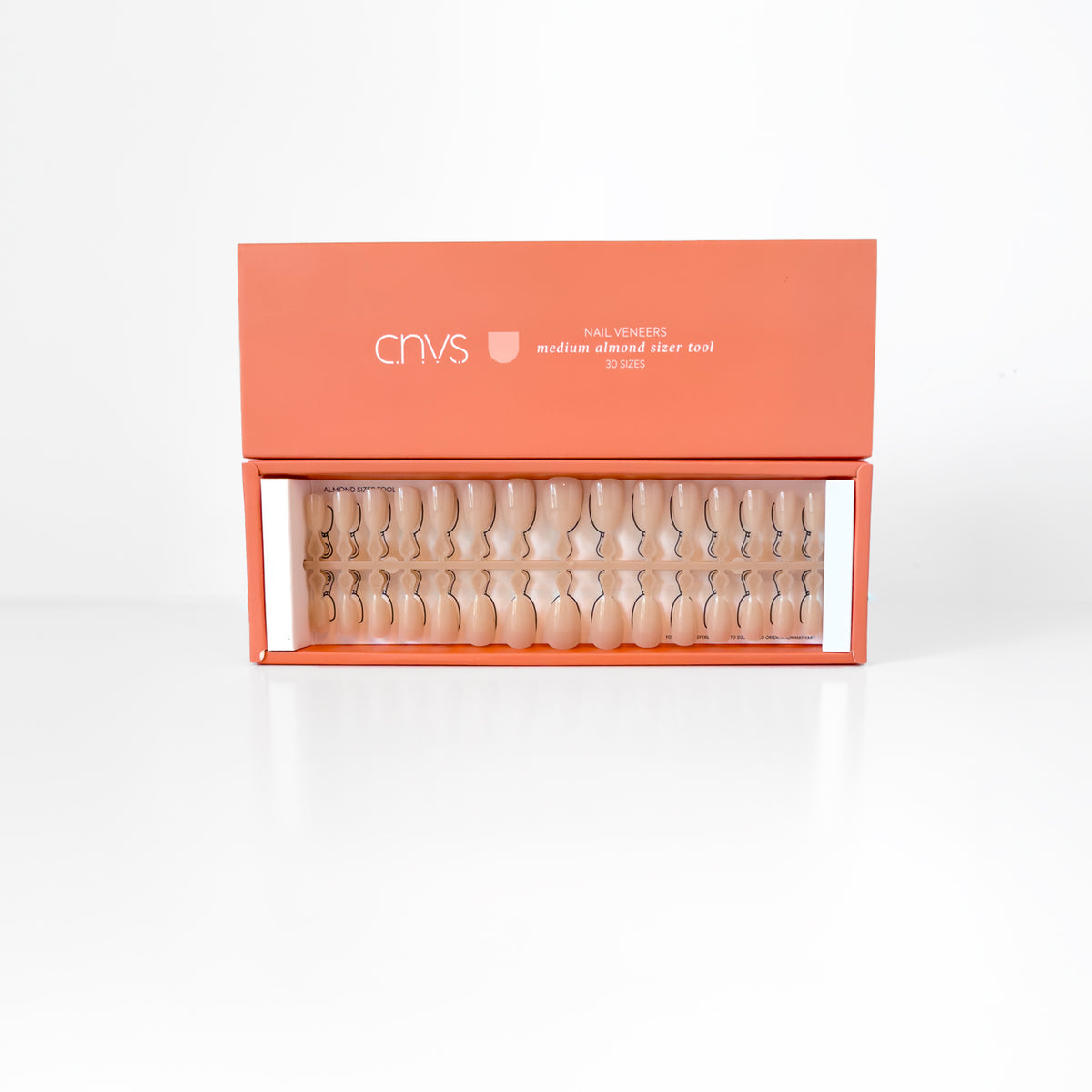 Two Medium Nude Almond Nail Sizer Tools with usable gel nail extensions by CNVS Nails