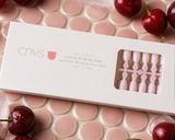 CNVS Nails Sizer tool displayed on pink tile with cherries